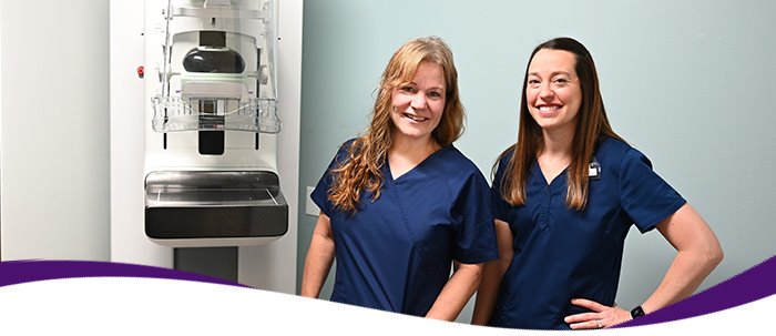 Two ARC mammography technicians next to a mammography machine at ARC Far West in Austin