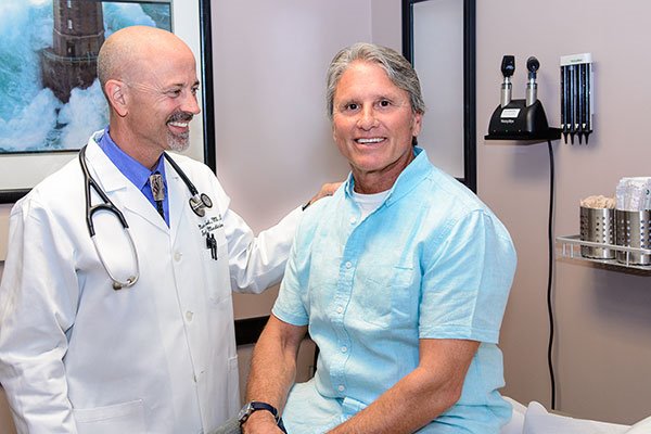 John, an ARC patient with ulcerative colitis, being seen by an ARC doctor