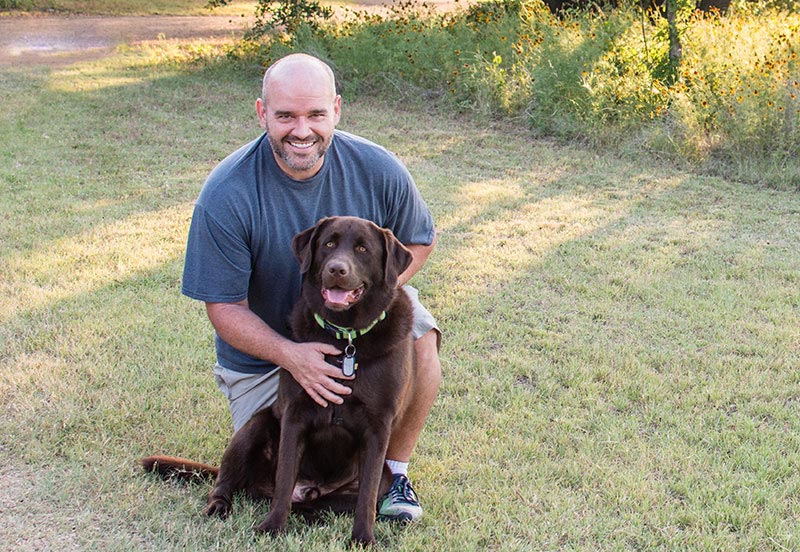 Paul, an ARC patient with type-2 diabetes, with a Chocolate Lab